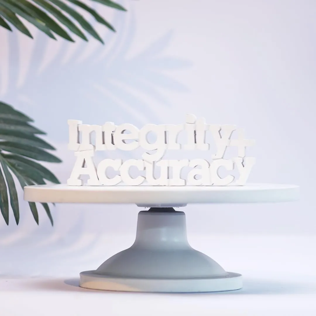 NUKKAD TALES Integrity   Accuracy White Motivational Quote Showpiece Décoration Items for Office Table Book Shelf Décor Birthday Gift Items Corporate Gifts for Employees (9 x 3.40 inch)