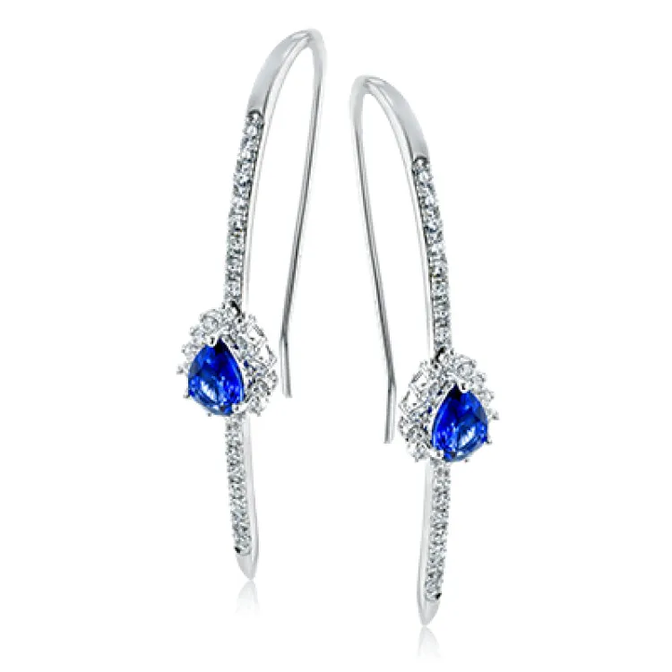 These distinctively modern linear earrings feature a splash of blue with pear shaped sapphires in their midst.