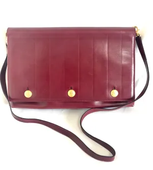 Vintage FENDI wine leather shoulder bag, large clutch purse with iconic Janus medallion embossed motifs at front. Unisex. 060620re5
