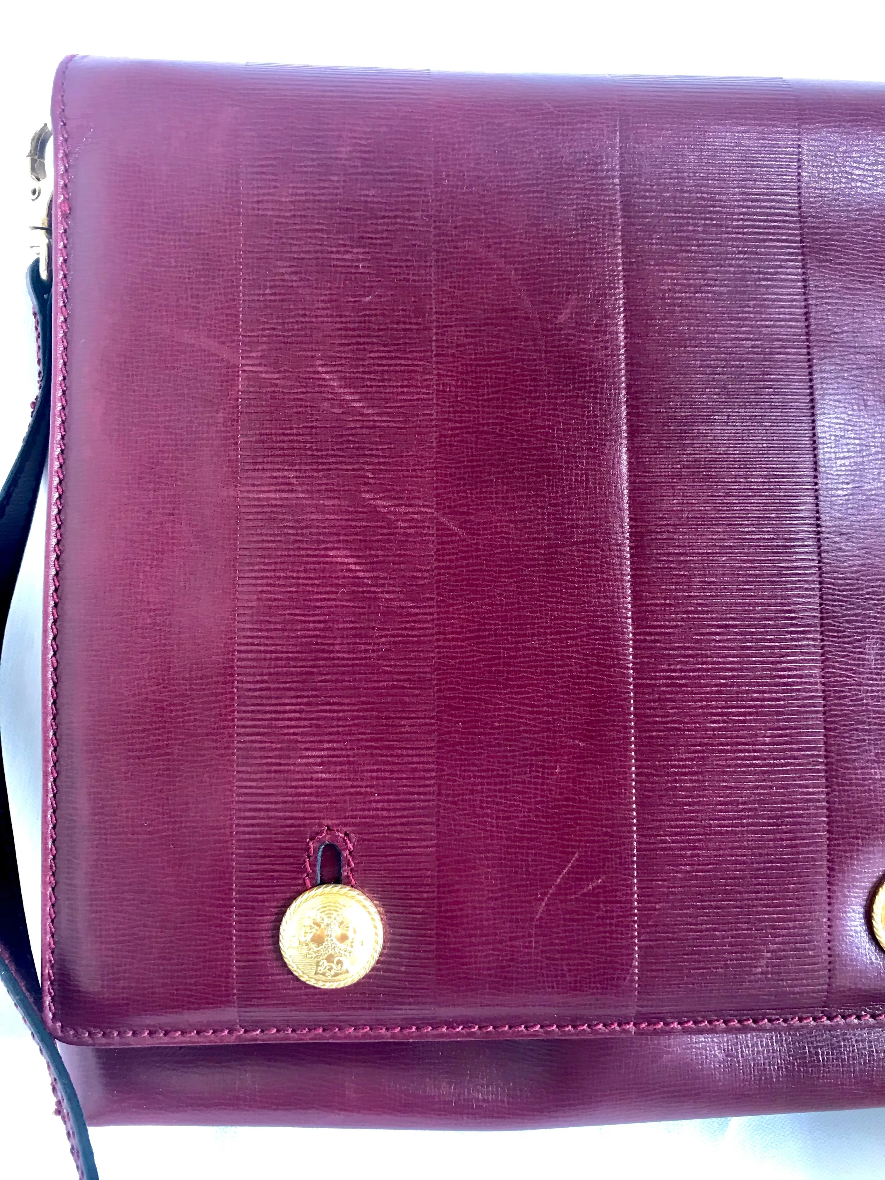 Vintage FENDI wine leather shoulder bag, large clutch purse with iconic Janus medallion embossed motifs at front. Unisex. 060620re5