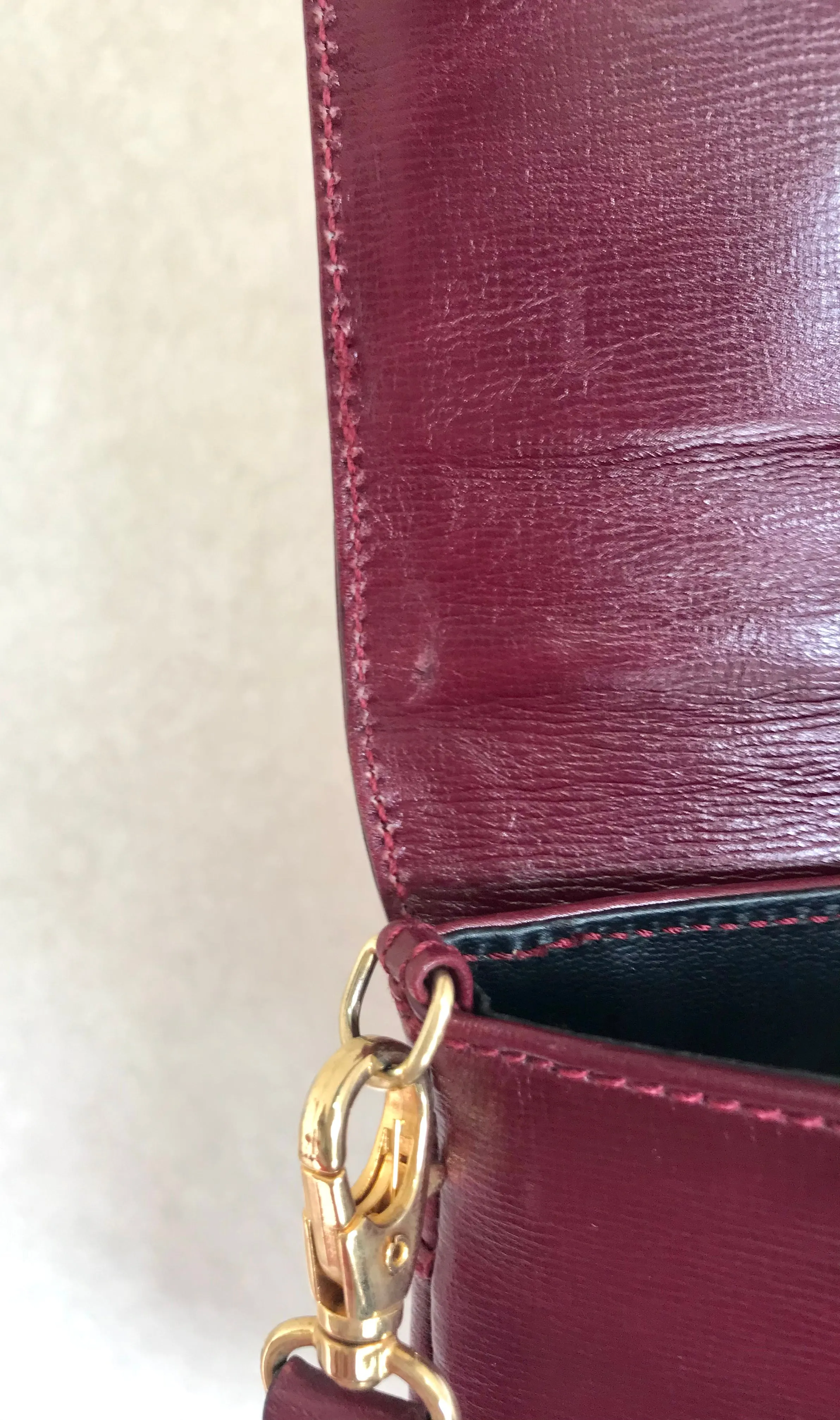 Vintage FENDI wine leather shoulder bag, large clutch purse with iconic Janus medallion embossed motifs at front. Unisex. 060620re5