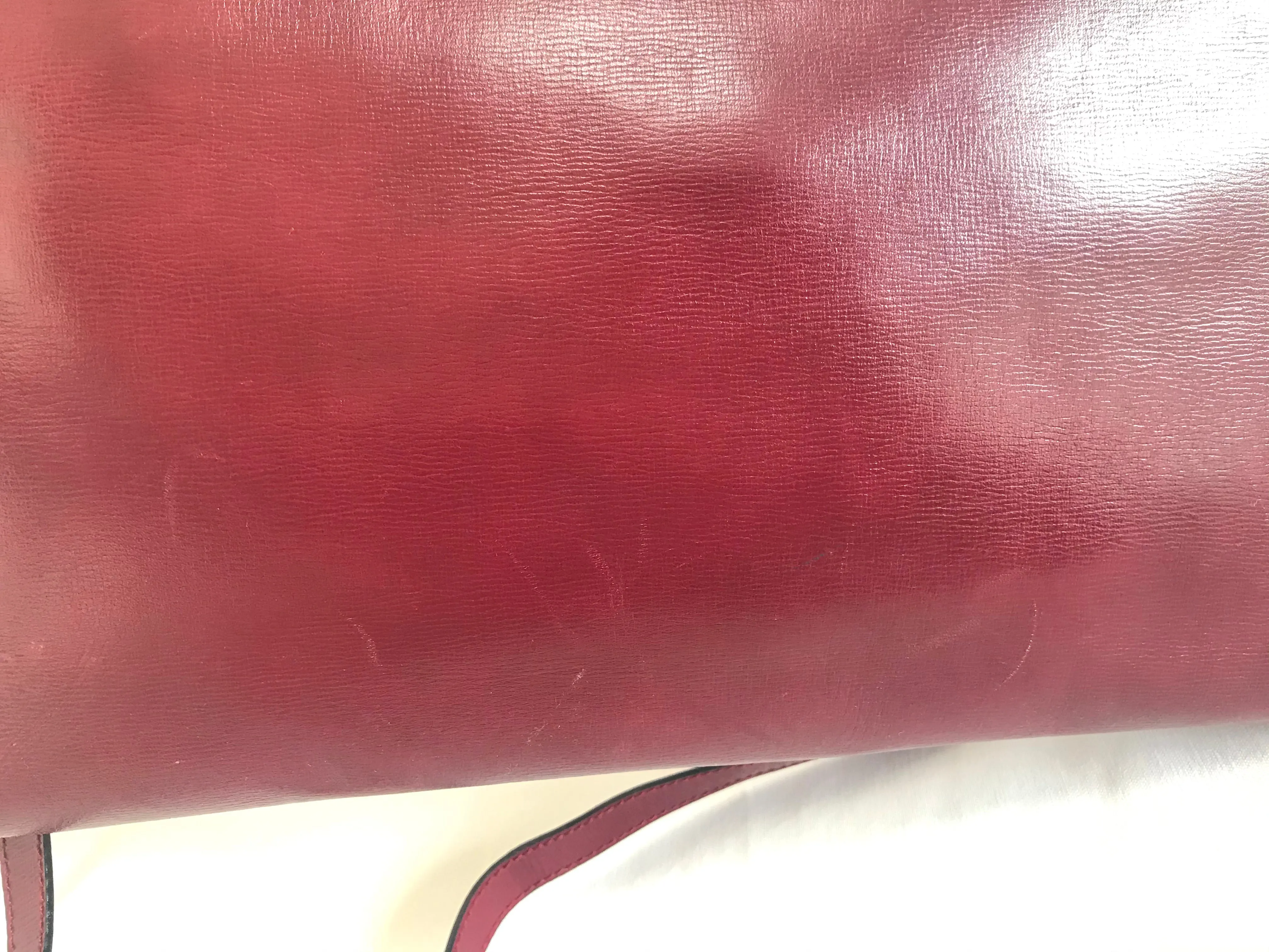Vintage FENDI wine leather shoulder bag, large clutch purse with iconic Janus medallion embossed motifs at front. Unisex. 060620re5