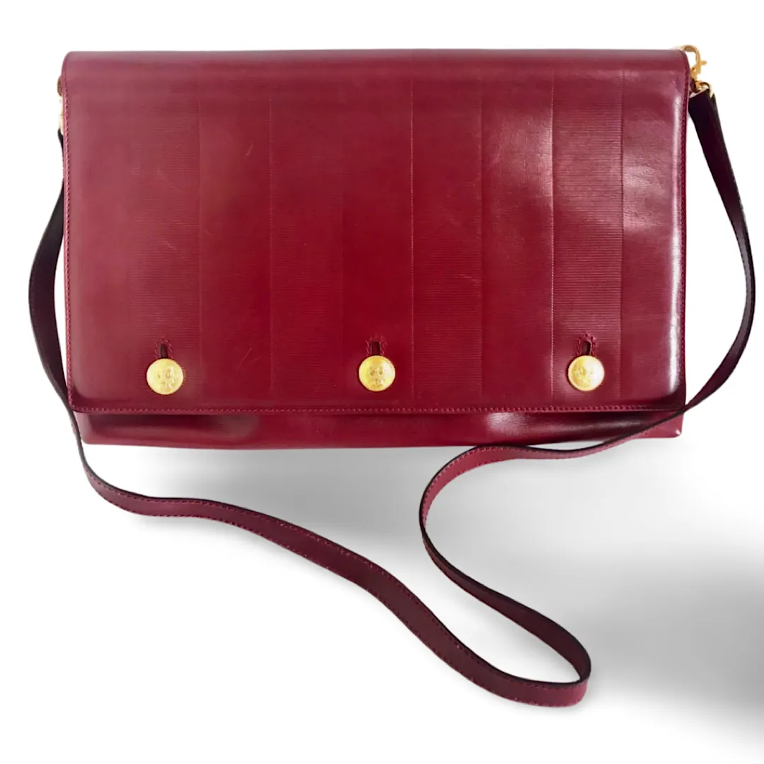 Vintage FENDI wine leather shoulder bag, large clutch purse with iconic Janus medallion embossed motifs at front. Unisex. 060620re5