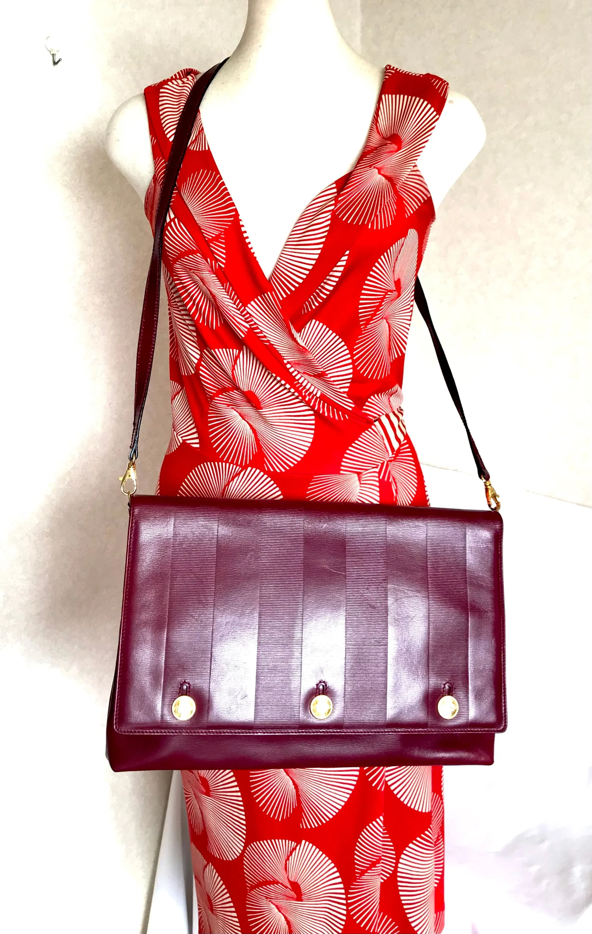 Vintage FENDI wine leather shoulder bag, large clutch purse with iconic Janus medallion embossed motifs at front. Unisex. 060620re5